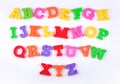 Colorful plastic alphabet letters on a white