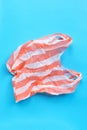 Colorful plastic bag on blue background. Environment pollution concept Royalty Free Stock Photo