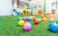 Colorful plastic ball on green turf at school playground Royalty Free Stock Photo
