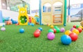 Colorful plastic ball on green turf at school playground Royalty Free Stock Photo