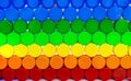 Colorful plastic bottle cap arrange with beautiful tone and pattern. Blue, green, yellow, orange, and red plastic bottle cap