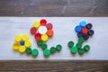 Colorful plastic bottle caps on rustic background. Ecology concepts