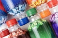 Colorful plastic bottles on a white background with copy space Royalty Free Stock Photo