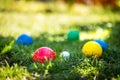 Colorful plastic boules or boccia balls are lying on a green meadow Royalty Free Stock Photo