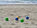 Colorful plastic bowls on the beach used to play petanque boul Royalty Free Stock Photo