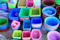 Colorful plastic buckets and containers on display at a sundry s