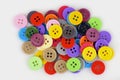 Colorful plastic buttons on a white background.