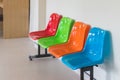 colorful plastic chairs in row for waiting room in hospital Royalty Free Stock Photo