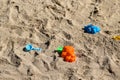 Colorful plastic children toys in sandbox at a playing ground Royalty Free Stock Photo
