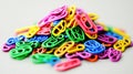 Colorful plastic clips piled on grey background, studio shot, craft supply Royalty Free Stock Photo