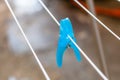 Colorful plastic clothes peg on empty metal clothes dryer Royalty Free Stock Photo