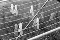 Colorful plastic clothes pegs on empty metal clothes dryer