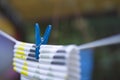 colorful plastic clothespin holding the washer on a string stretched in the garden Royalty Free Stock Photo