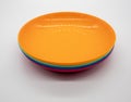 Colorful plastic dishes on white background Royalty Free Stock Photo