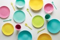 Colorful plastic dishes on white background Royalty Free Stock Photo