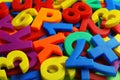 Colorful plastic magnetic letters and numbers as background