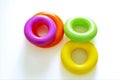 Colorful plastic rings on a white background to be stacked in a tower Royalty Free Stock Photo