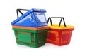 Colorful plastic shopping baskets on white Royalty Free Stock Photo