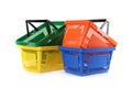 Colorful plastic shopping baskets on white Royalty Free Stock Photo