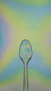 Colorful plastic spoon, photo elasticity