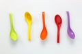 Colorful plastic spoon on white table background with c Royalty Free Stock Photo