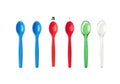 Colorful plastic spoons arrayed on black background, ready for use and fun Royalty Free Stock Photo
