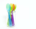 Colorful plastic spoons and forks in jar . Royalty Free Stock Photo