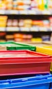 Colorful plastic storage boxes in a supermarket aisle. Royalty Free Stock Photo