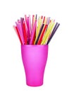 Colorful plastic straws in cup white background isolated close up, disposable drinking pipes in glass, tubes for beverage cocktail Royalty Free Stock Photo