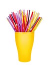 Colorful plastic straws in cup white background isolated close up, disposable drinking pipes in glass, tubes for beverage cocktail Royalty Free Stock Photo