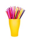 Colorful plastic straws in cup white background isolated close up, disposable drinking pipes in glass, tubes for beverage cocktail Royalty Free Stock Photo