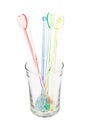 Colorful plastic swizzle sticks in glass Royalty Free Stock Photo