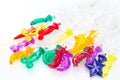 Colorful plastic swizzle sticks on white background Royalty Free Stock Photo