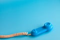 Colorful plastic toy mobile phone on a blue background Royalty Free Stock Photo