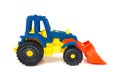 Plastic toy wheeled tractor loader excavator, isolated Royalty Free Stock Photo