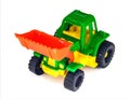 Plastic toy wheeled tractor loader excavator, isolated Royalty Free Stock Photo