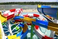 Colorful plastic water-slides in aqua park. Part of the water park - a slide element of blue, yellow, red, white. Dnipro Royalty Free Stock Photo