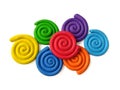 Colorful spiral plasticine, rainbow colored clay dough, white background