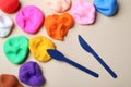 Colorful plasticine and tools on beige background, flat lay Royalty Free Stock Photo