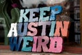 Colorful plate with word Austin in front of a shop window