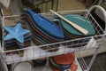 Colorful plates of fish shapes selling on the market close-up. Tableware on shelves