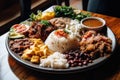 colorful platter of colombian food, with assortment of rice, beans, and meats