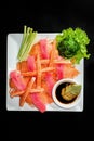 A colorful platter of sashimi sushi with tuna and crab sticks Royalty Free Stock Photo