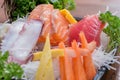 A colorful platter of sashimi sushi with tuna and crab sticks Royalty Free Stock Photo