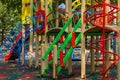 Colorful playground equipment for children in public park Royalty Free Stock Photo