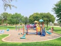 Colorful playground in green park near residential area in Richardson, Texas, USA