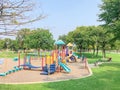 Colorful playground in green park near residential area in Richardson, Texas, USA
