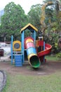 A colorful playhouse with some slides