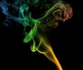 Colorful plume smoke isolated on black background. Royalty Free Stock Photo