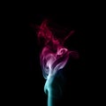 Colorful plume smoke isolated on black background Royalty Free Stock Photo